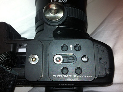 Photograph of the M-Plate Pro attached to a Canon camera
